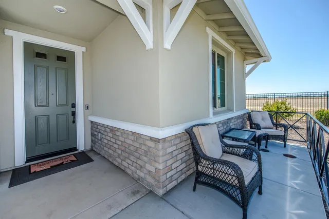 a view of balcony with furniture