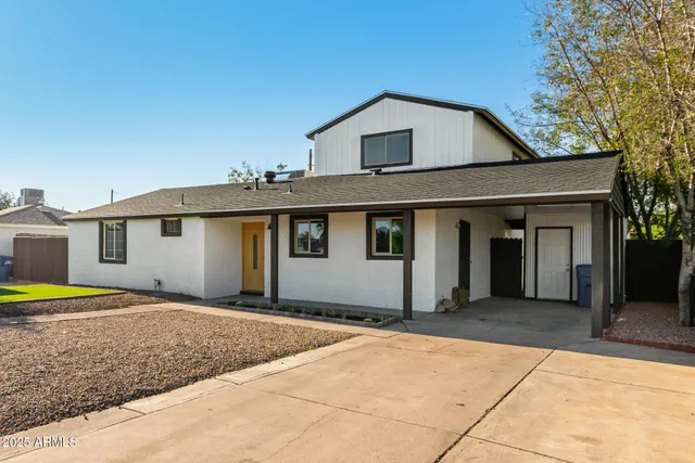 a front view of a house with a garage