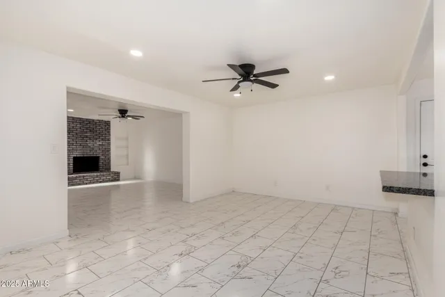 an empty room with a empty space and windows