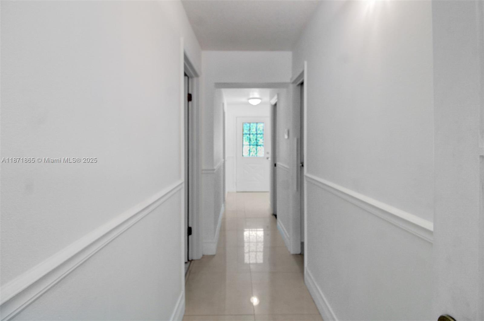 9930 Southwest 48th Street Miami, FL 33165 - Photo 16 of 29 a view of a hallway with wooden floor