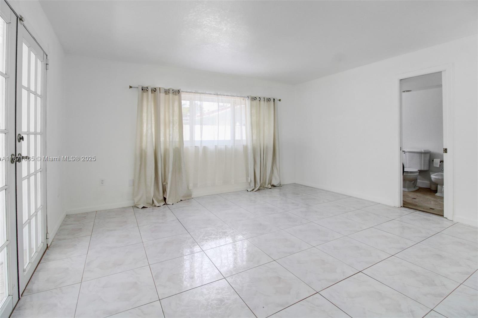 9930 Southwest 48th Street Miami, FL 33165 - Photo 22 of 29 a view of an empty room with a window