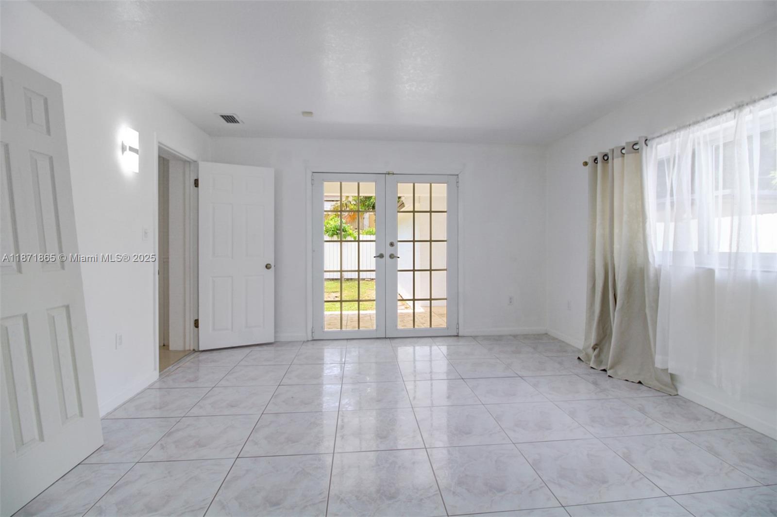 9930 Southwest 48th Street Miami, FL 33165 - Photo 23 of 29 a view of an empty room with a window