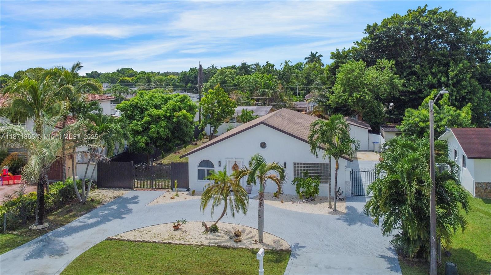 9930 Southwest 48th Street Miami, FL 33165 - Photo 3 of 29 a view of a backyard with plants and a patio