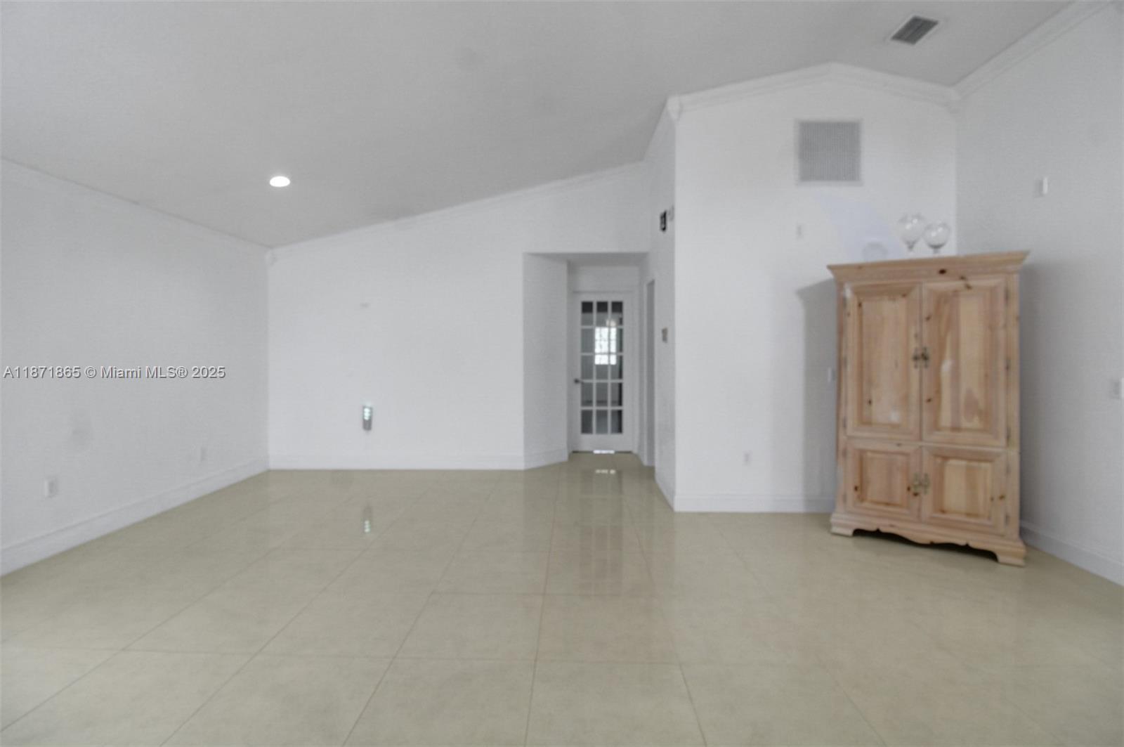9930 Southwest 48th Street Miami, FL 33165 - Photo 10 of 29 an empty room with windows