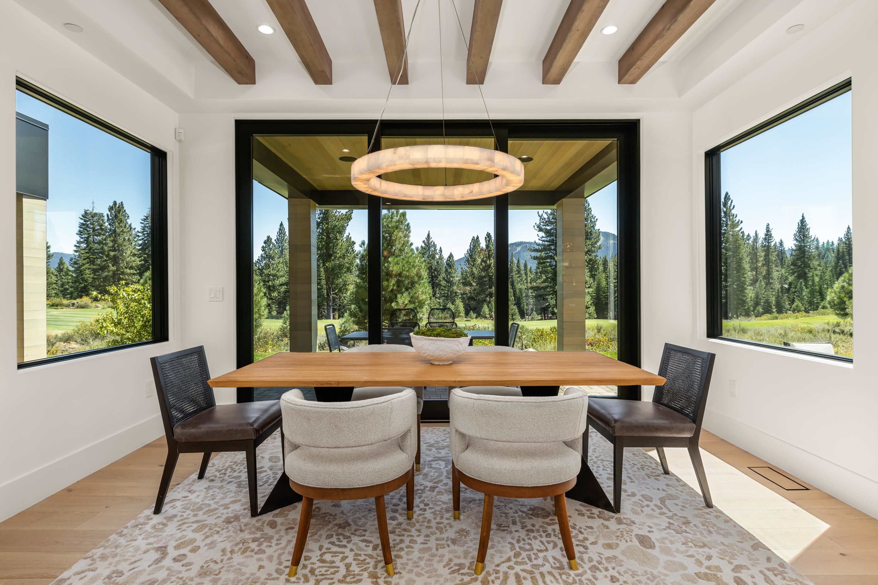 9308 Gaston Court Truckee, CA 96161 - Photo 7 of 28 a dining room with furniture and a large window