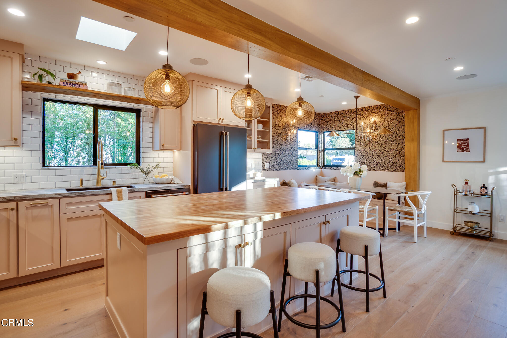2425 Cooley Place Pasadena, CA 91104 - Photo 14 of 74 a kitchen with stainless steel appliances granite countertop a table chairs sink and wooden floor