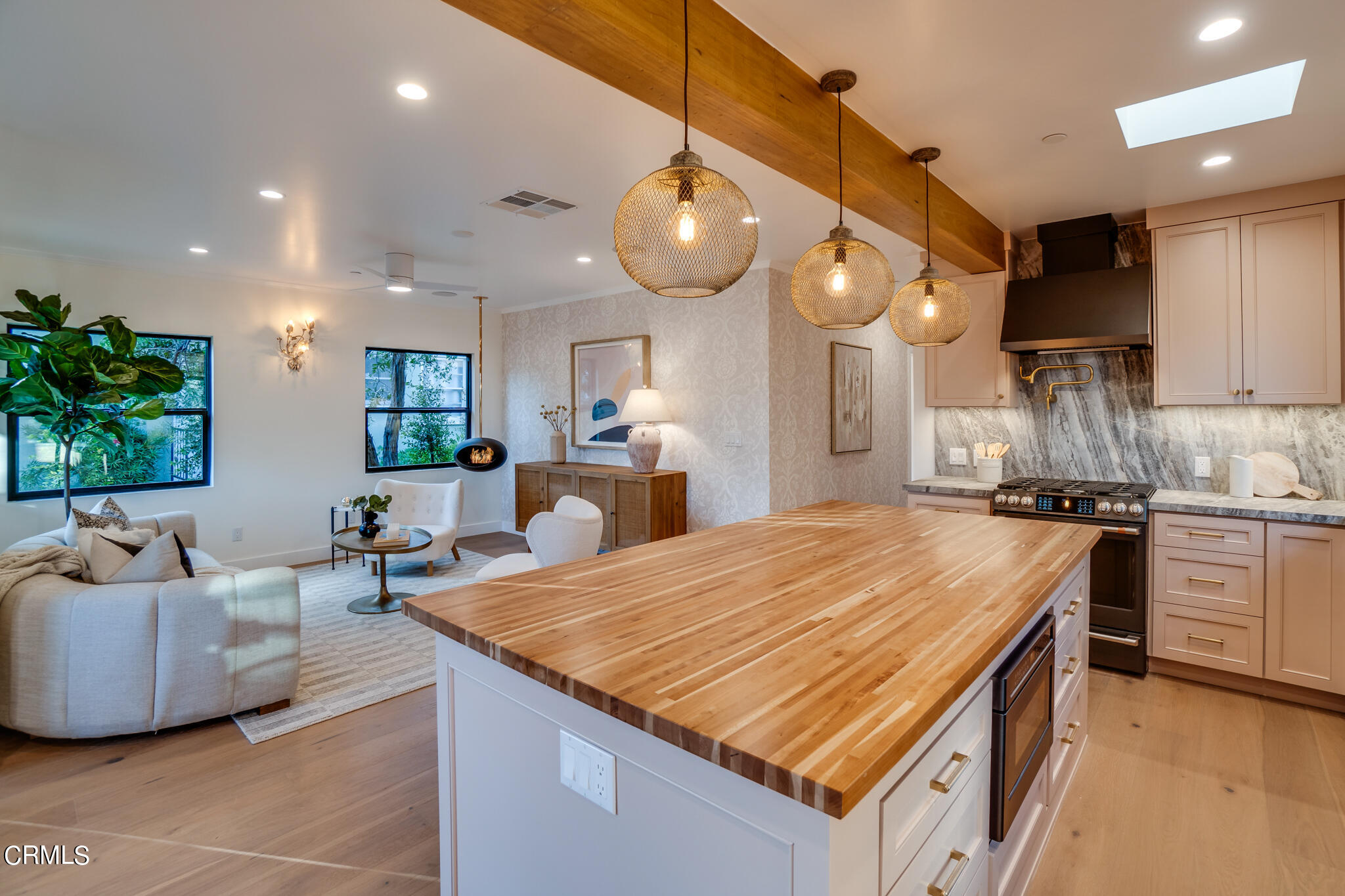 2425 Cooley Place Pasadena, CA 91104 - Photo 21 of 74 a large kitchen with kitchen island a large counter space a sink stainless steel appliances and cabinets