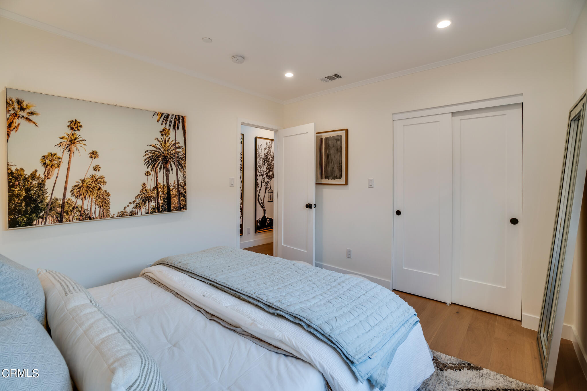 2425 Cooley Place Pasadena, CA 91104 - Photo 33 of 74 a bedroom with a large bed and a painting on the wall