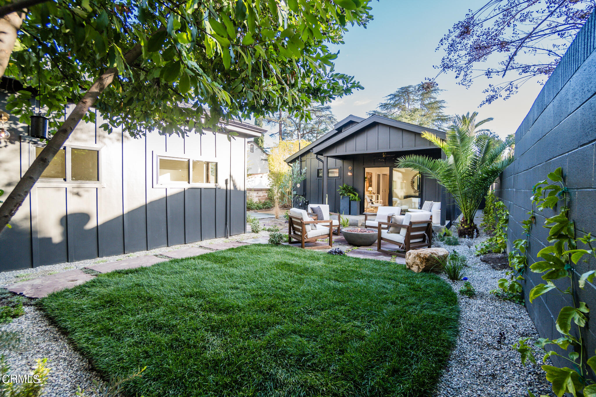 2425 Cooley Place Pasadena, CA 91104 - Photo 56 of 74 a view of a chair and table in backyard of the house