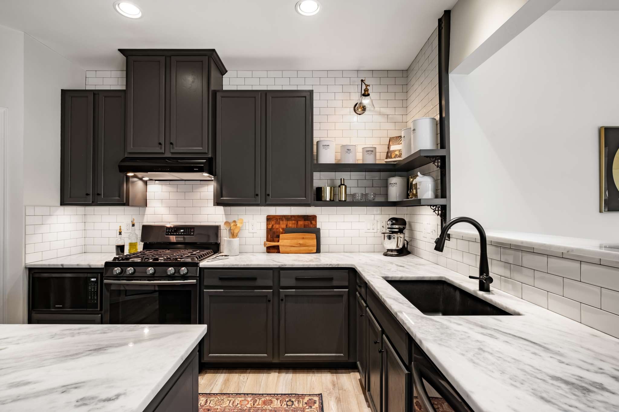 2000 Kingston Place Spring Hill, TN 37174 - Photo 11 of 56 a kitchen with granite countertop a stove sink and cabinets