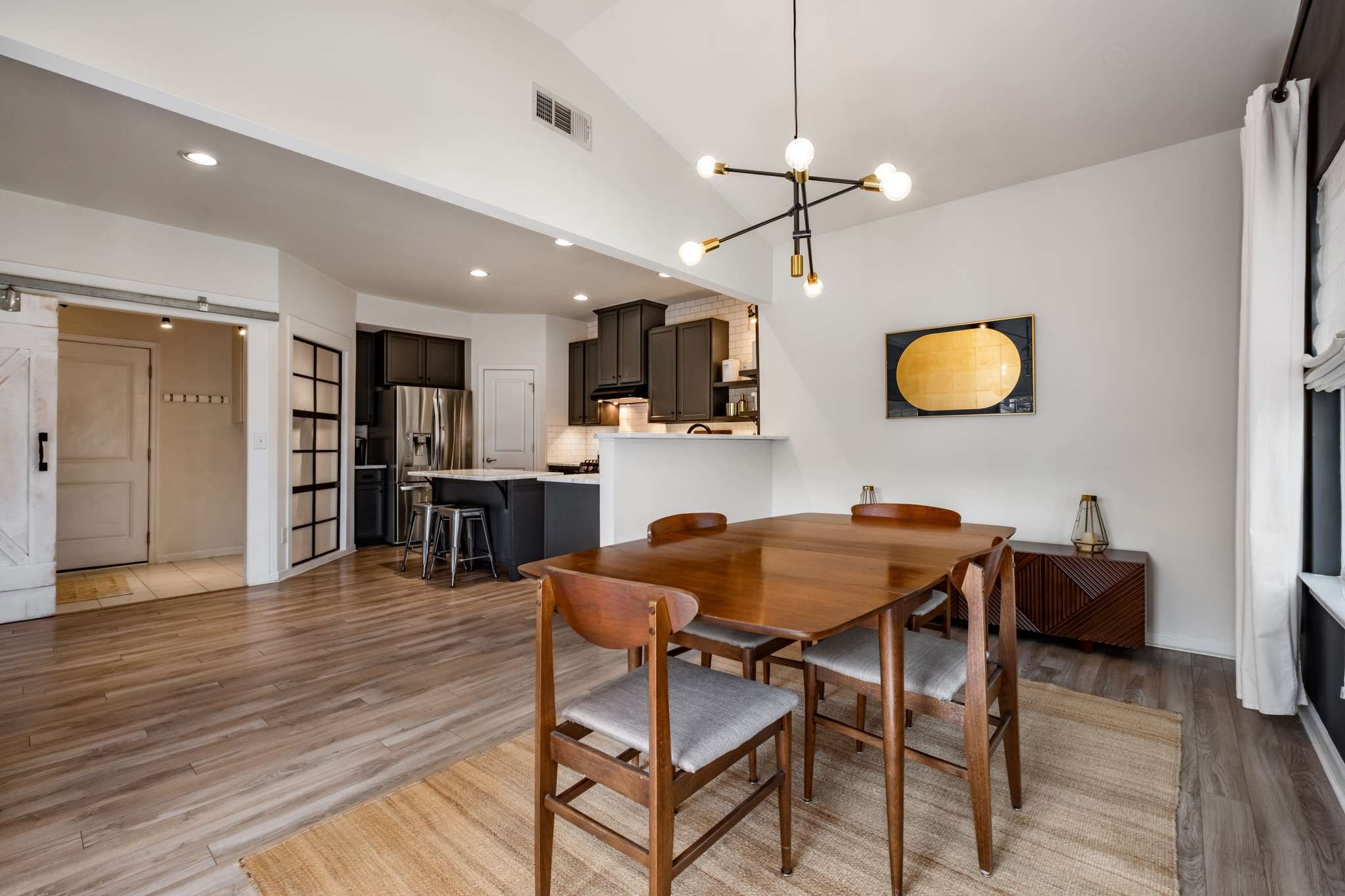 2000 Kingston Place Spring Hill, TN 37174 - Photo 17 of 56 a view of a dining room with furniture and wooden floor