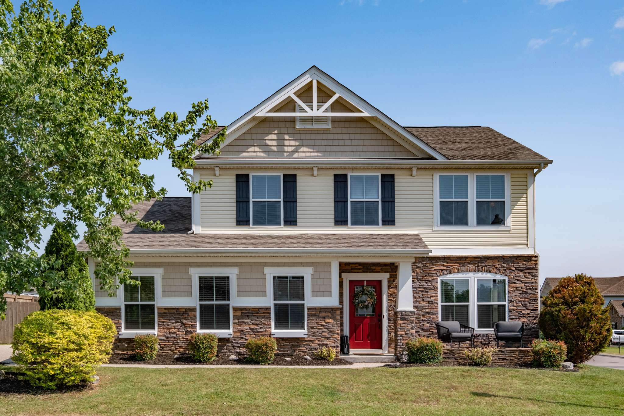 2000 Kingston Place Spring Hill, TN 37174 - Photo 2 of 56 a front view of a house with garden