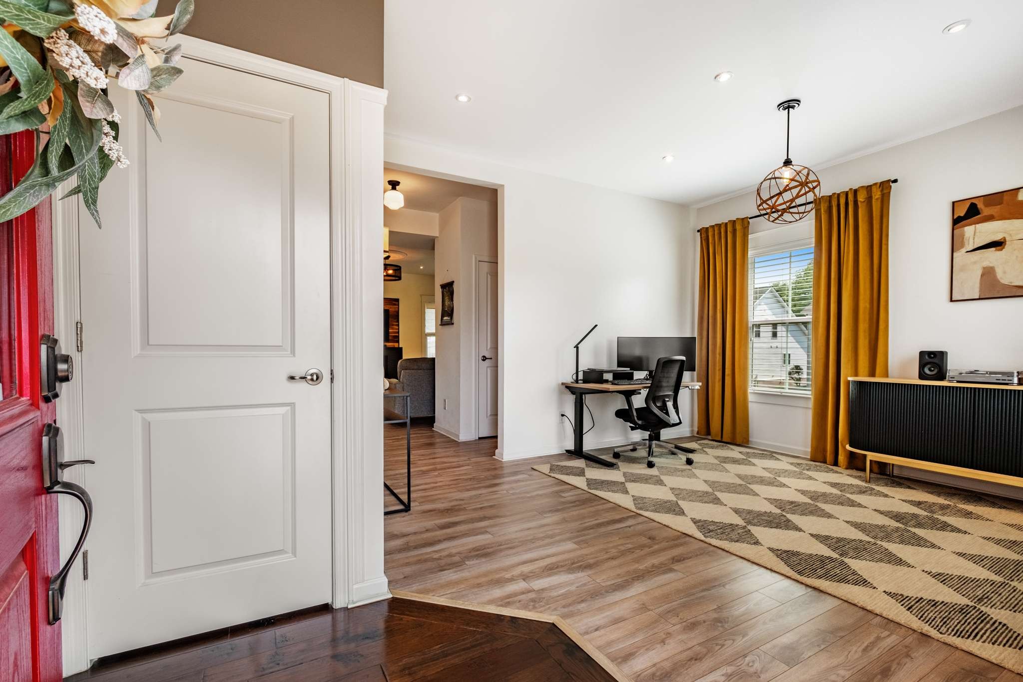 2000 Kingston Place Spring Hill, TN 37174 - Photo 21 of 56 a view of a livingroom with wooden floor and a chandelier