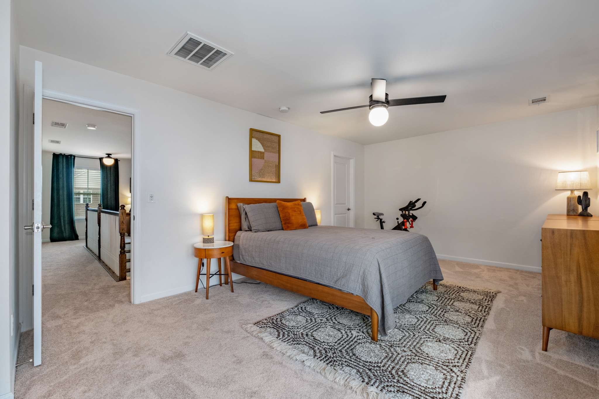 2000 Kingston Place Spring Hill, TN 37174 - Photo 32 of 56 a bedroom with a bed and a chandelier