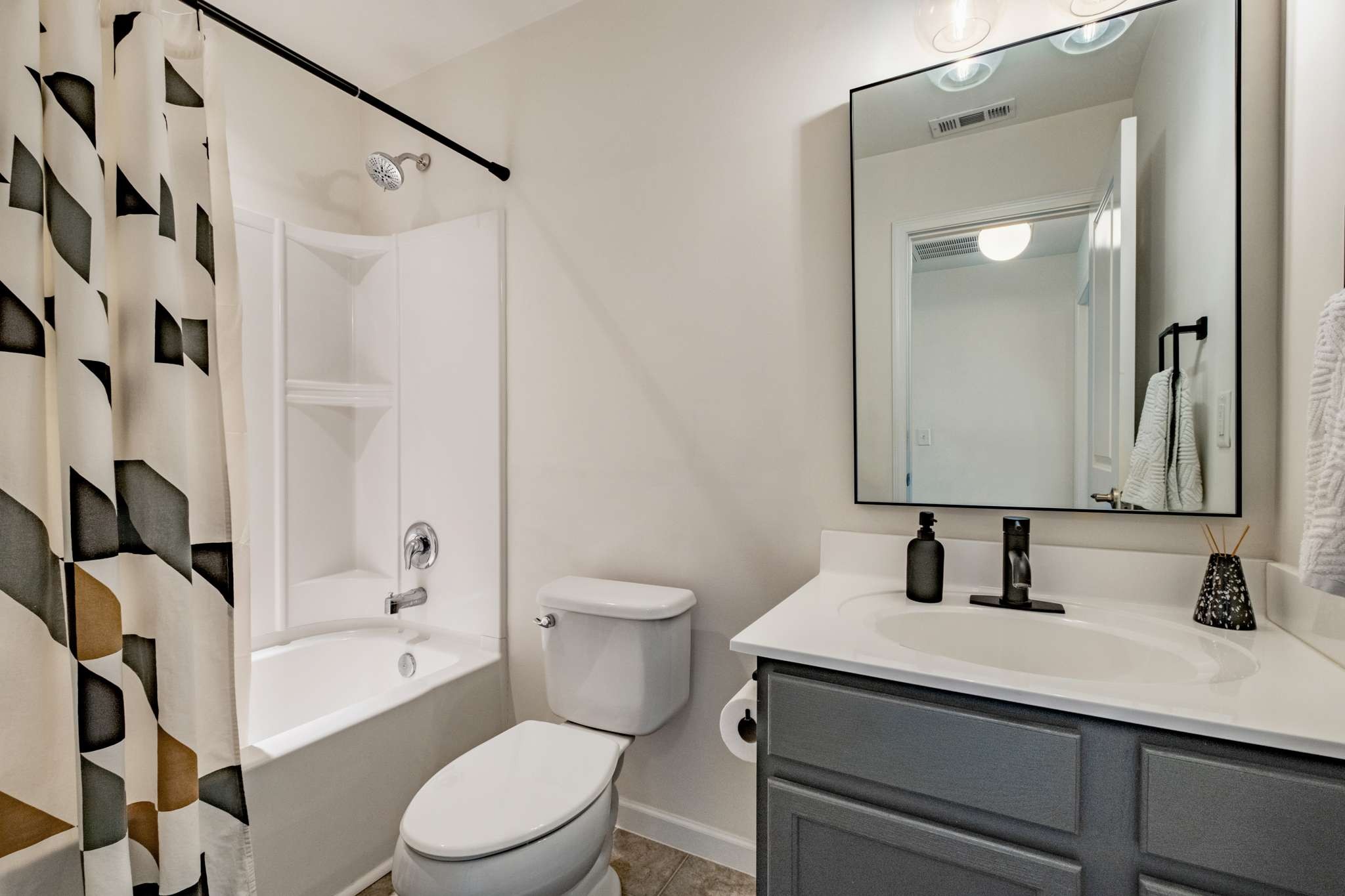 2000 Kingston Place Spring Hill, TN 37174 - Photo 37 of 56 a bathroom with a sink a toilet and shower