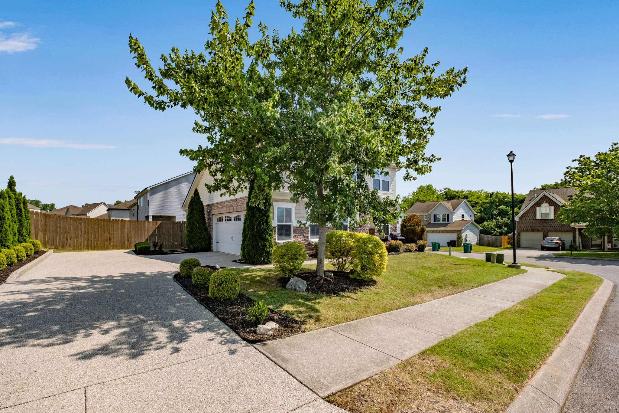 2000 Kingston Place Spring Hill, TN 37174 - Photo 41 of 56 a view of a house with a yard and tree s