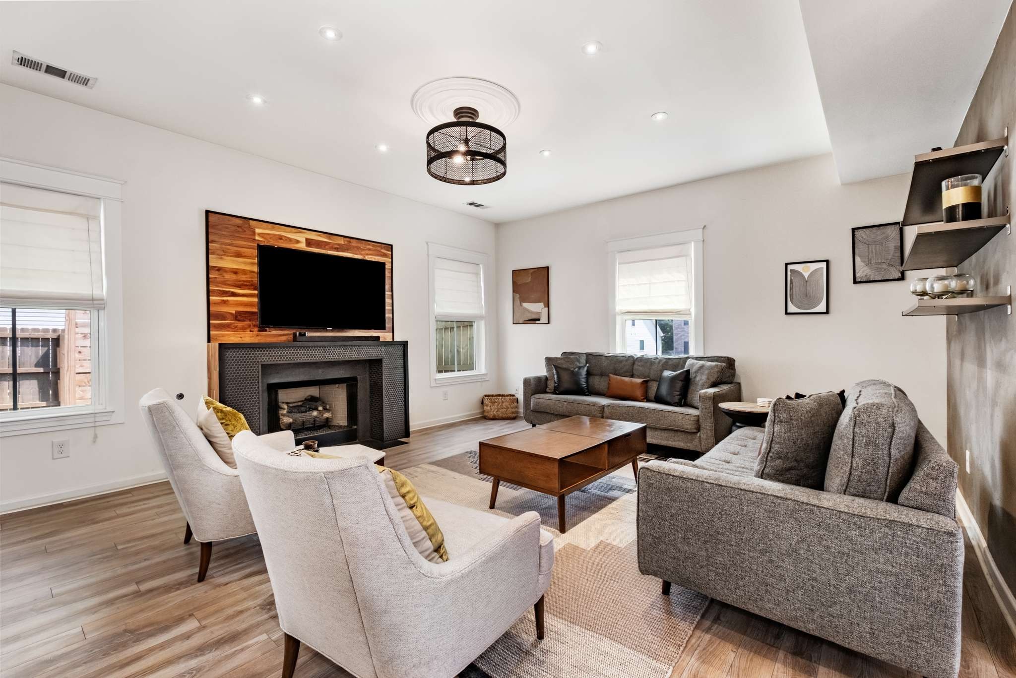 2000 Kingston Place Spring Hill, TN 37174 - Photo 5 of 56 a living room with fireplace furniture and a flat screen tv