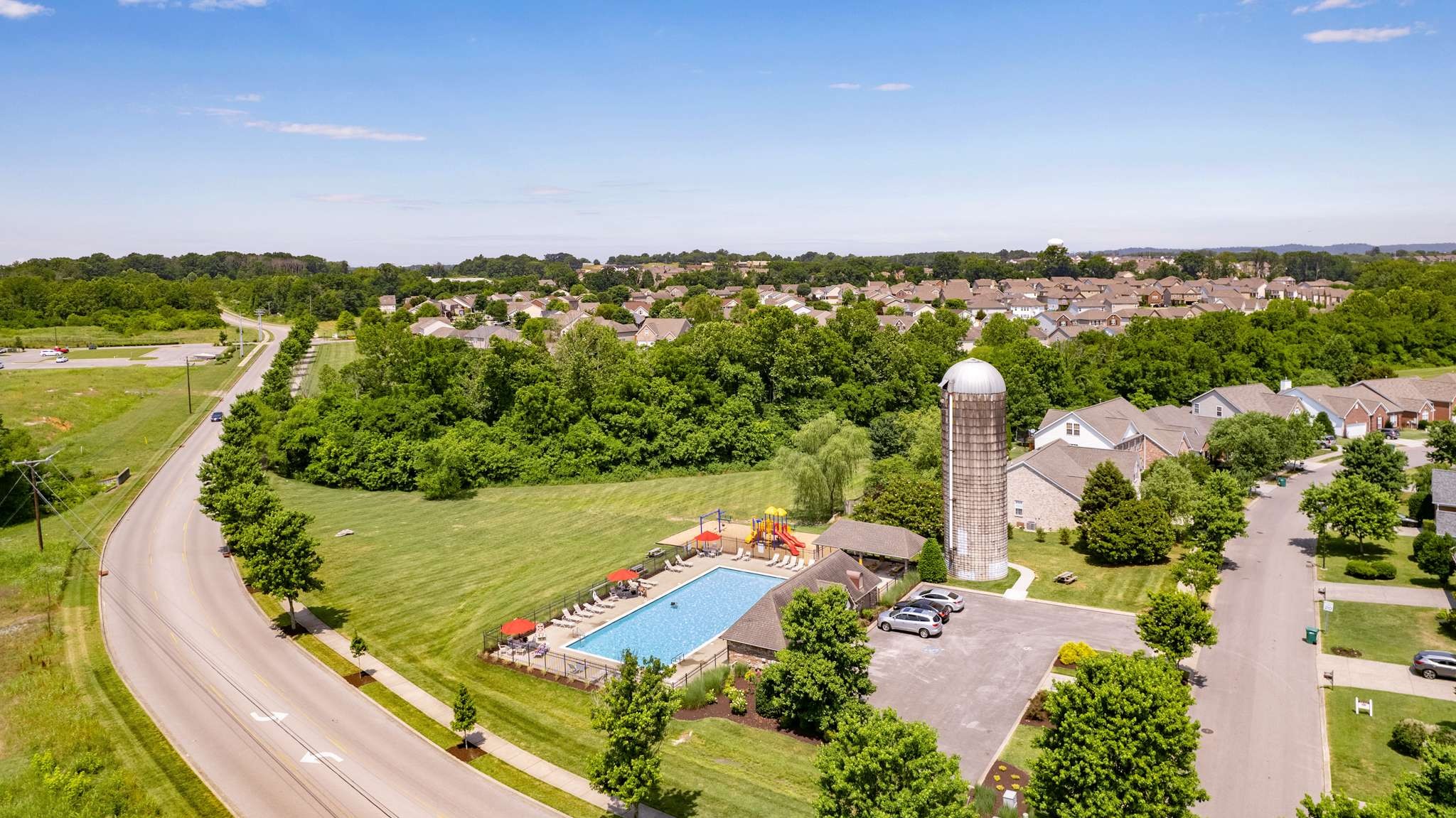 2000 Kingston Place Spring Hill, TN 37174 - Photo 54 of 56 an aerial view of a city with lots of residential buildings and ocean view in back
