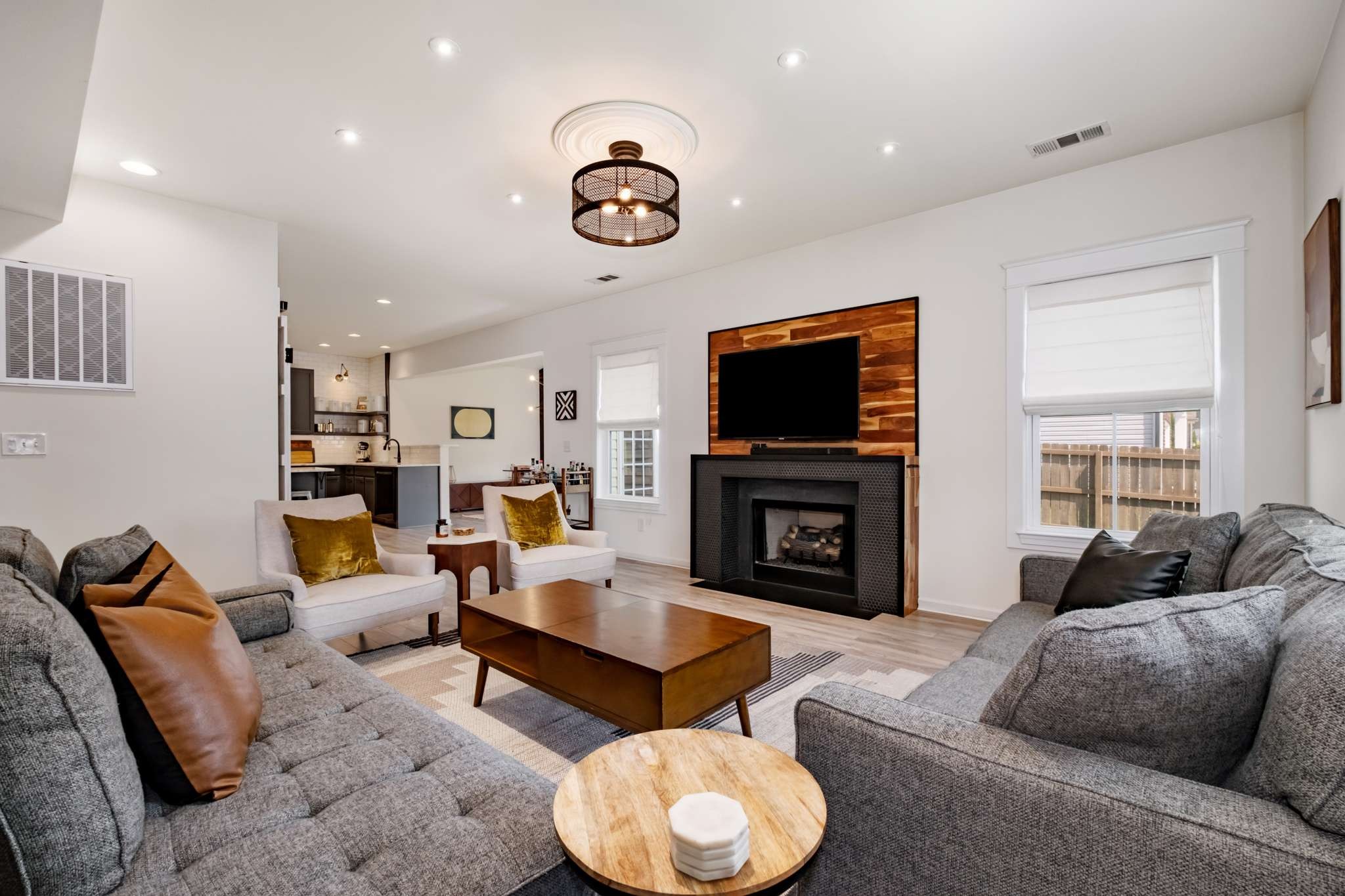 2000 Kingston Place Spring Hill, TN 37174 - Photo 6 of 56 a living room with fireplace furniture and a flat screen tv