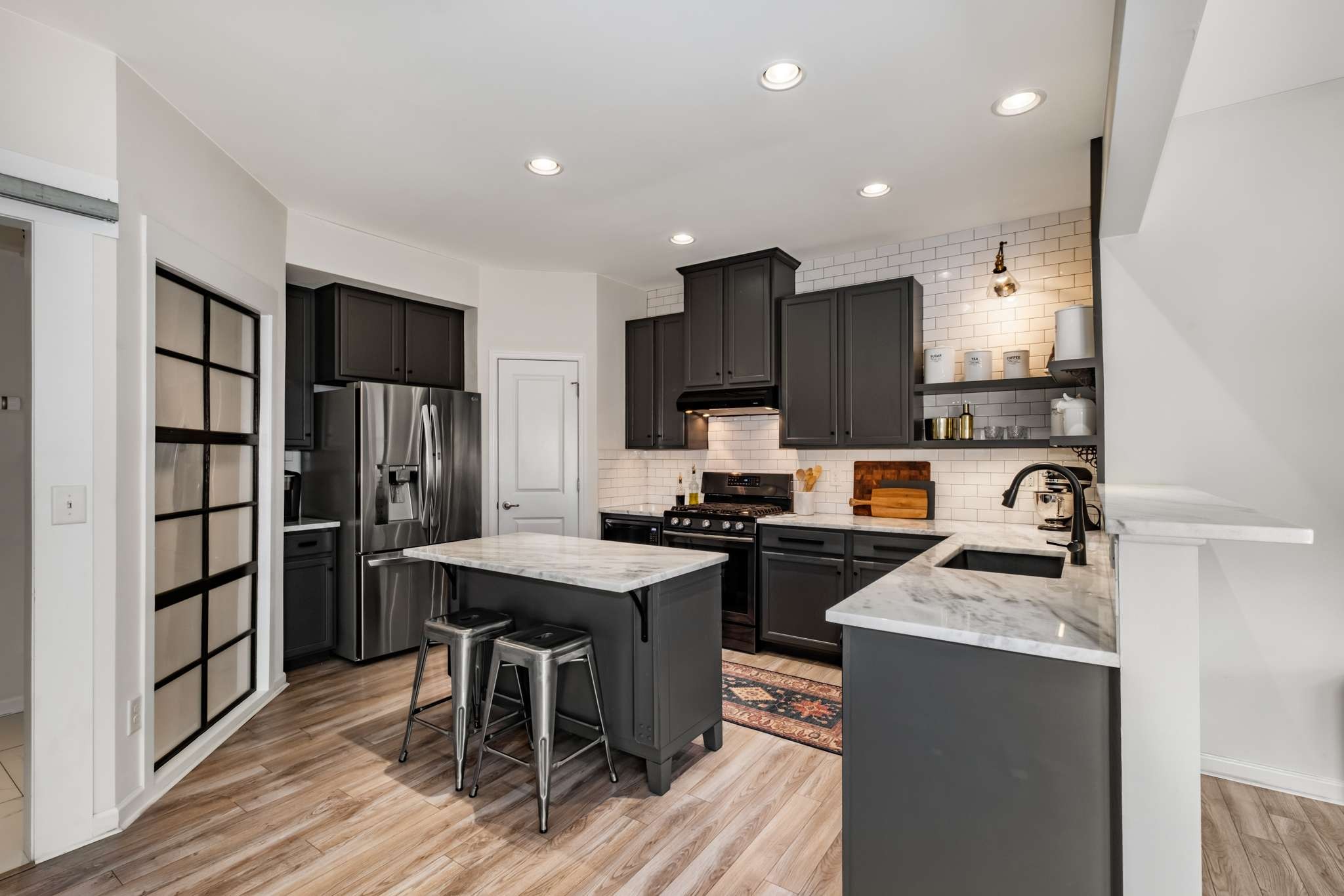 2000 Kingston Place Spring Hill, TN 37174 - Photo 10 of 56 a kitchen with stainless steel appliances granite countertop a refrigerator stove microwave and sink