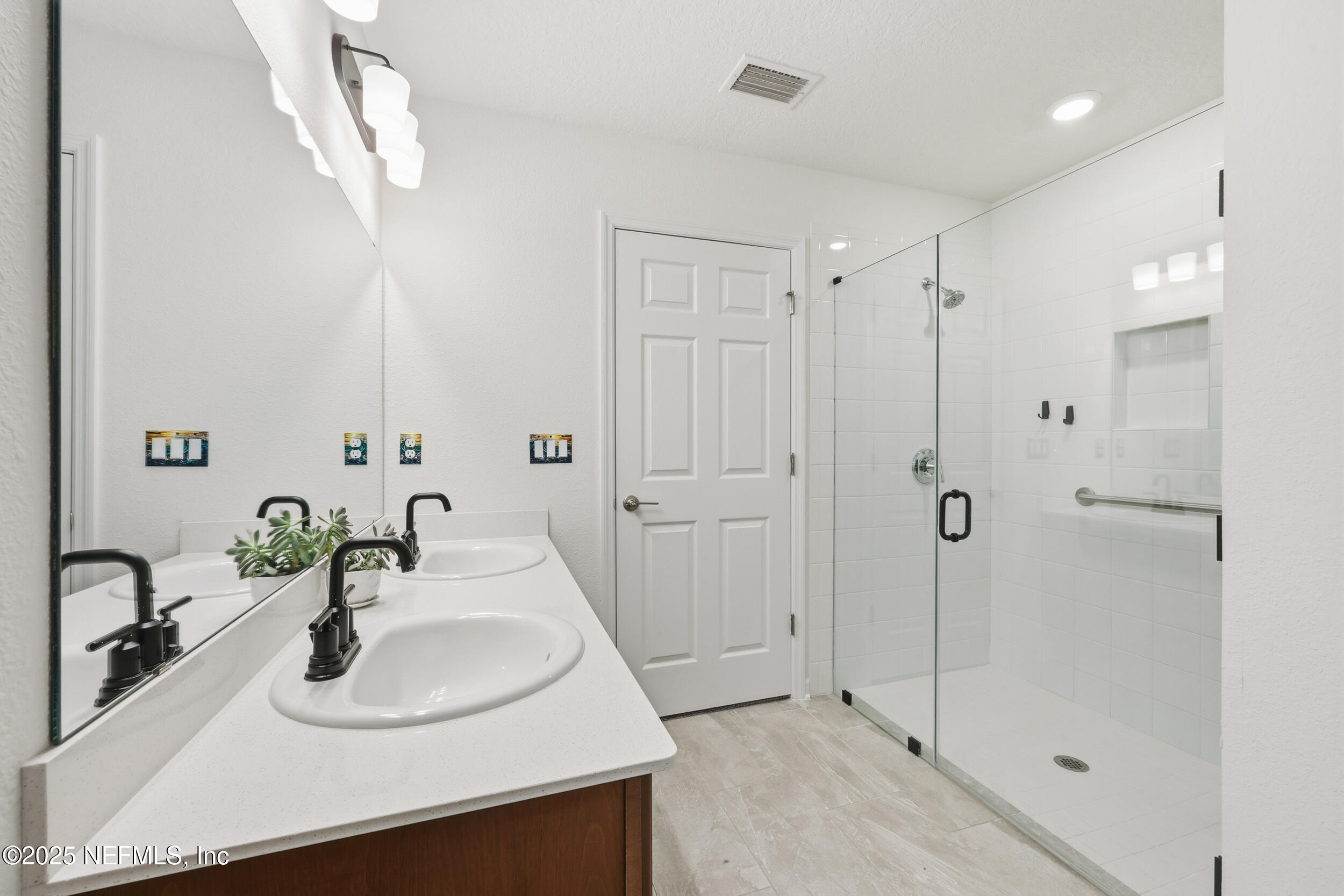 335 Boulder Lane St. Johns, FL 32259 - Photo 15 of 32 a bathroom with double sink and a mirror