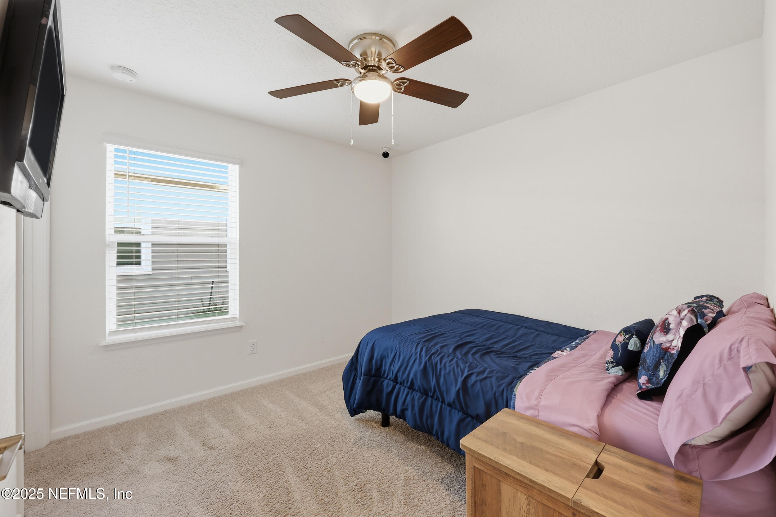 335 Boulder Lane St. Johns, FL 32259 - Photo 19 of 32 a bedroom with a bed and a ceiling fan