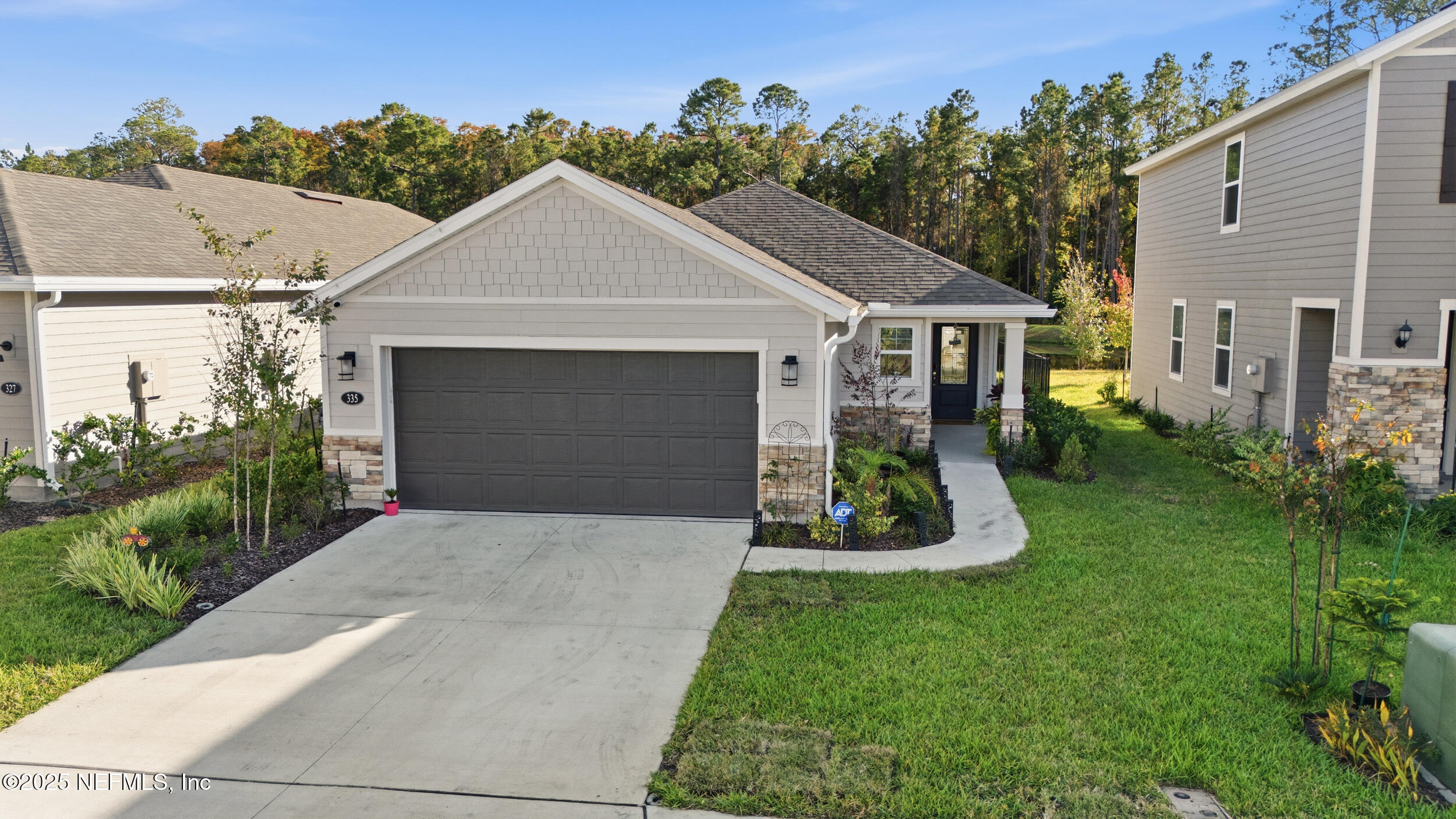 335 Boulder Lane St. Johns, FL 32259 - Photo 24 of 32 a front view of house with yard and green space