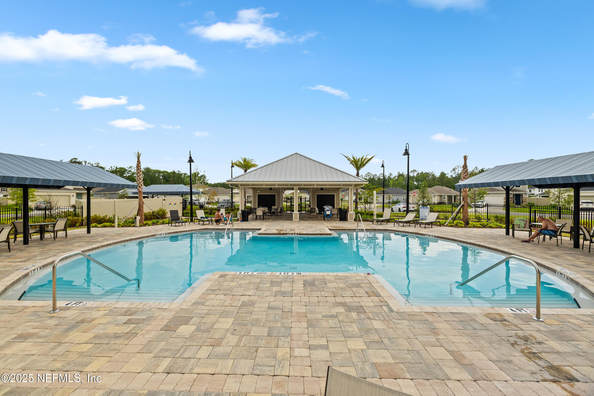 335 Boulder Lane St. Johns, FL 32259 - Photo 29 of 32 a view of a swimming pool with a lounge chair
