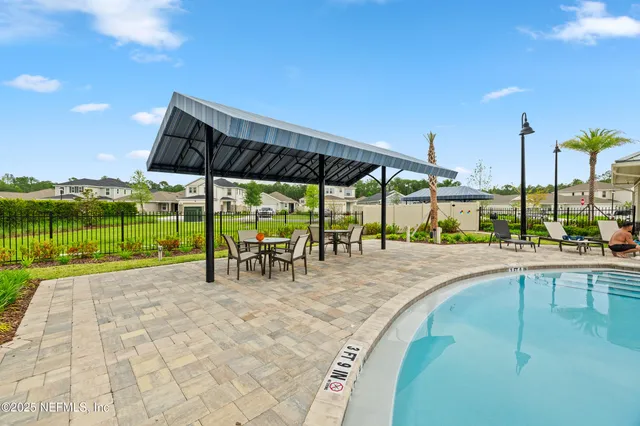 a view of a swimming pool with a lounge chair