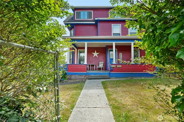 a view of front of house with a swimming pool