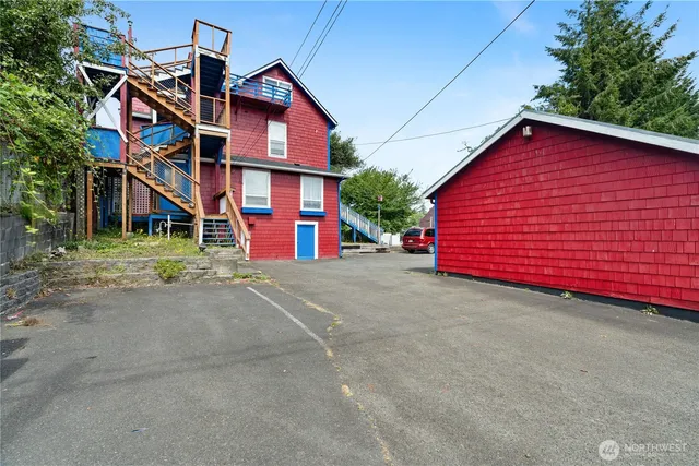 an aerial view of a house with a yard and potted plants