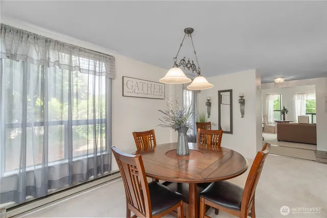 a view of a dining room with furniture window and outside view