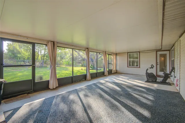a view of a bedroom with large windows