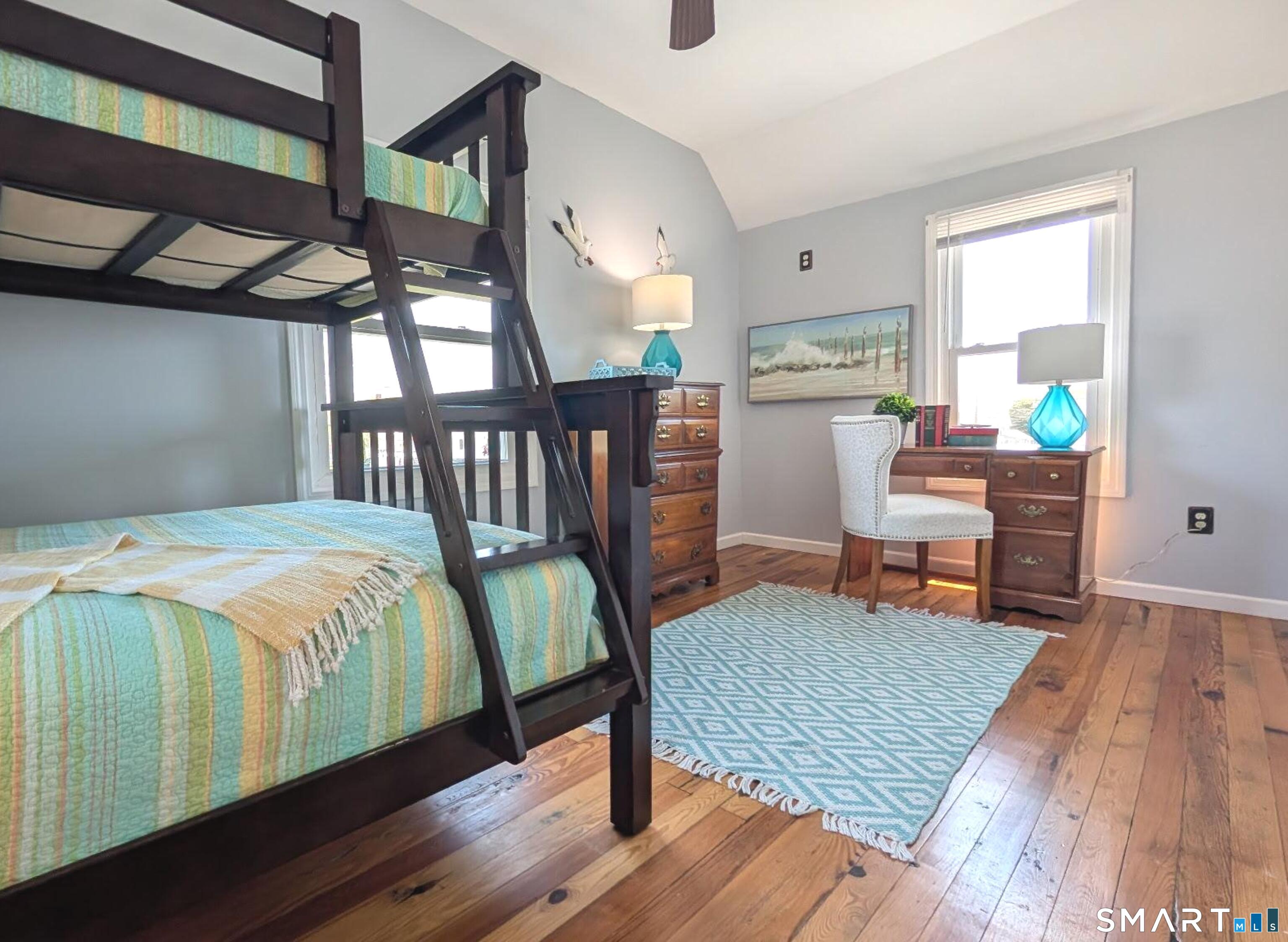 31 Old Colony Road Old Lyme, CT 06371 - Photo 21 of 38 a bedroom with a bed a table and chair
