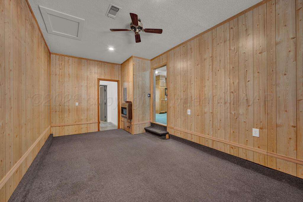 5025 South Crockett Street Amarillo, TX 79110 - Photo 15 of 30 a view of empty room with ceiling fan