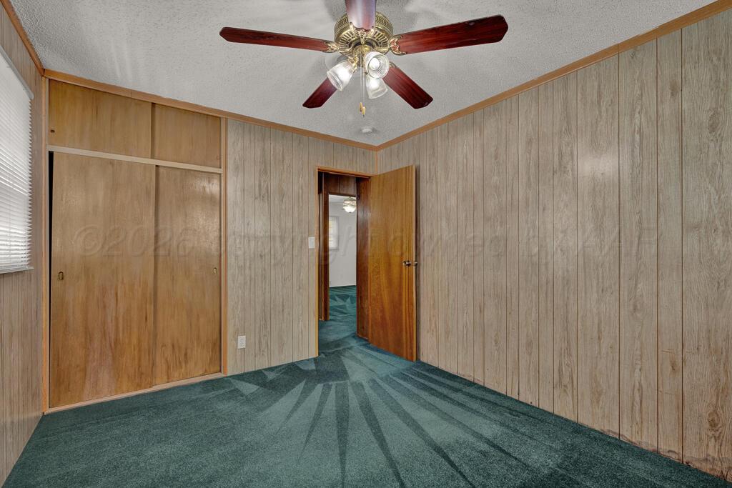 5025 South Crockett Street Amarillo, TX 79110 - Photo 22 of 30 a view of empty room with wooden floor