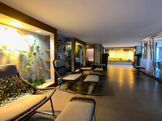 a room with lots of furniture and a view of living room