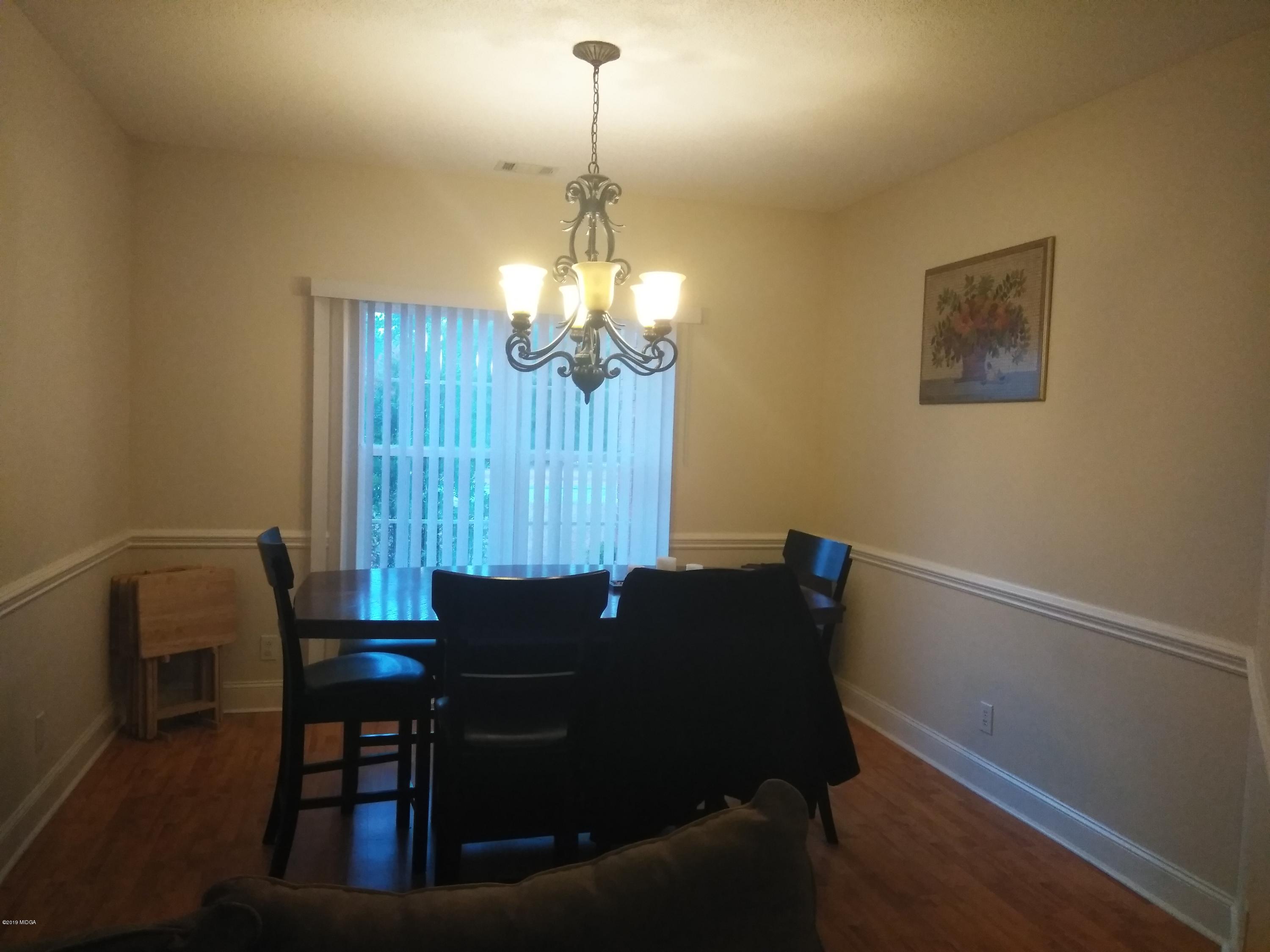 304 Browning Pointe Road Macon, GA 31216 - Photo 2 of 15 a table and chairs in a room