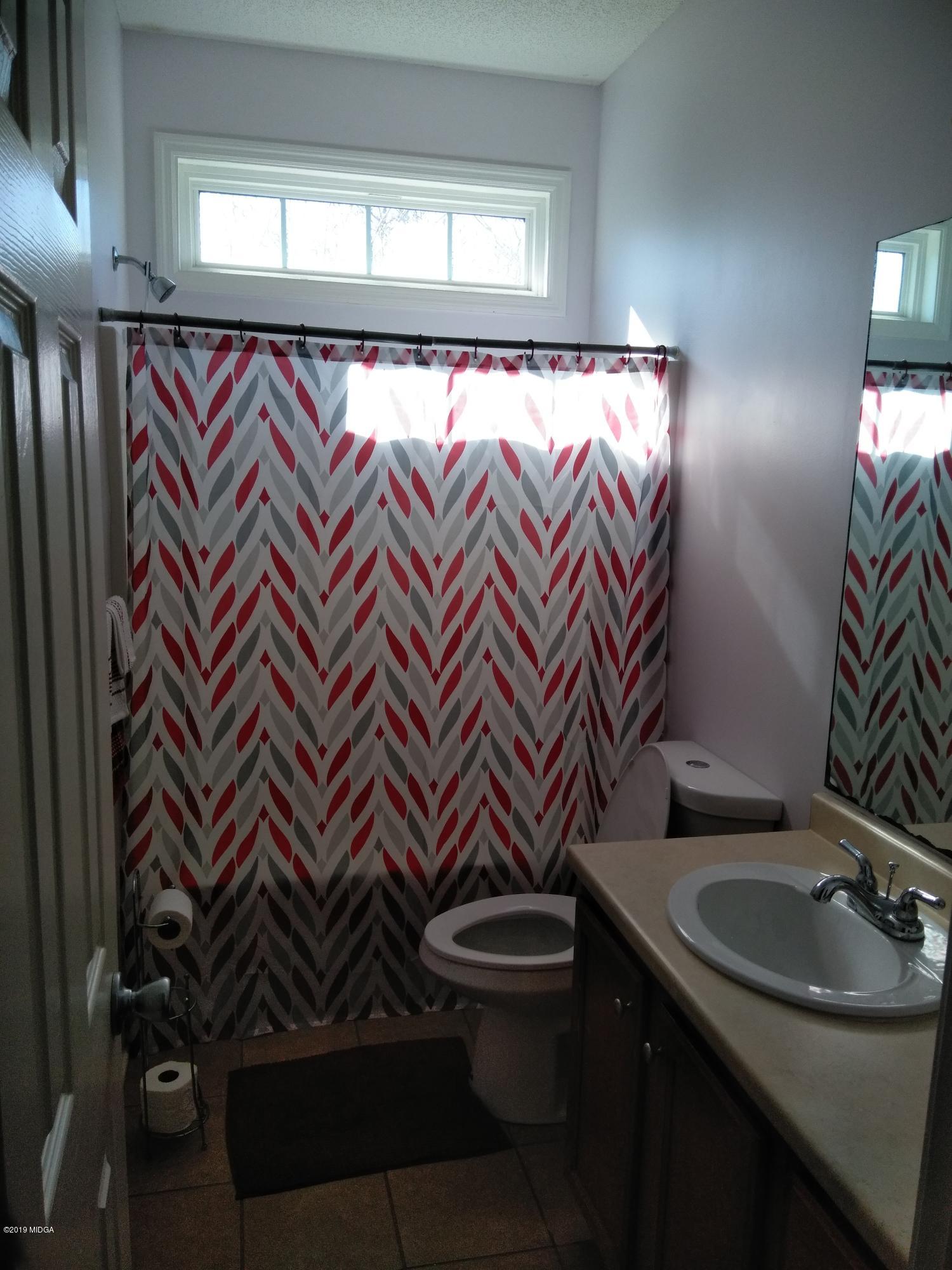 304 Browning Pointe Road Macon, GA 31216 - Photo 12 of 15 a bathroom with a sink and a mirror
