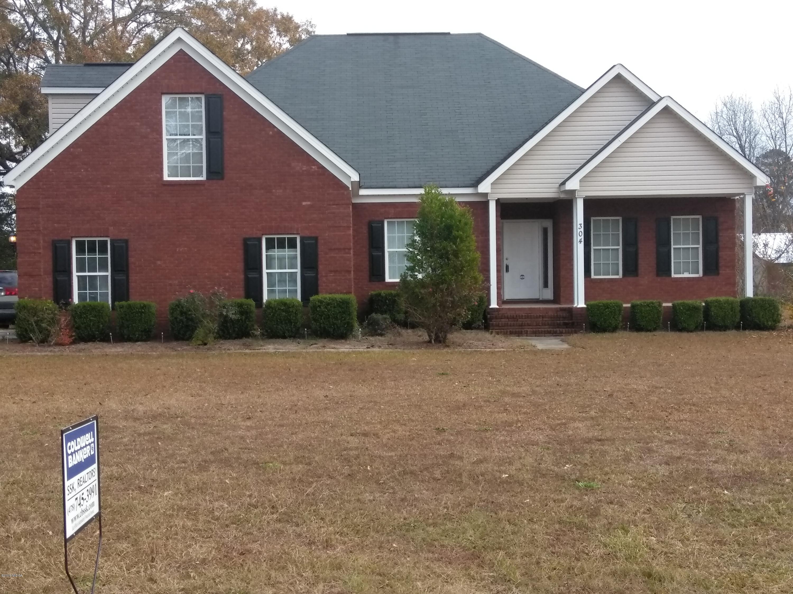 304 Browning Pointe Road Macon, GA 31216 - Photo 8 of 15 a front view of a house with garden