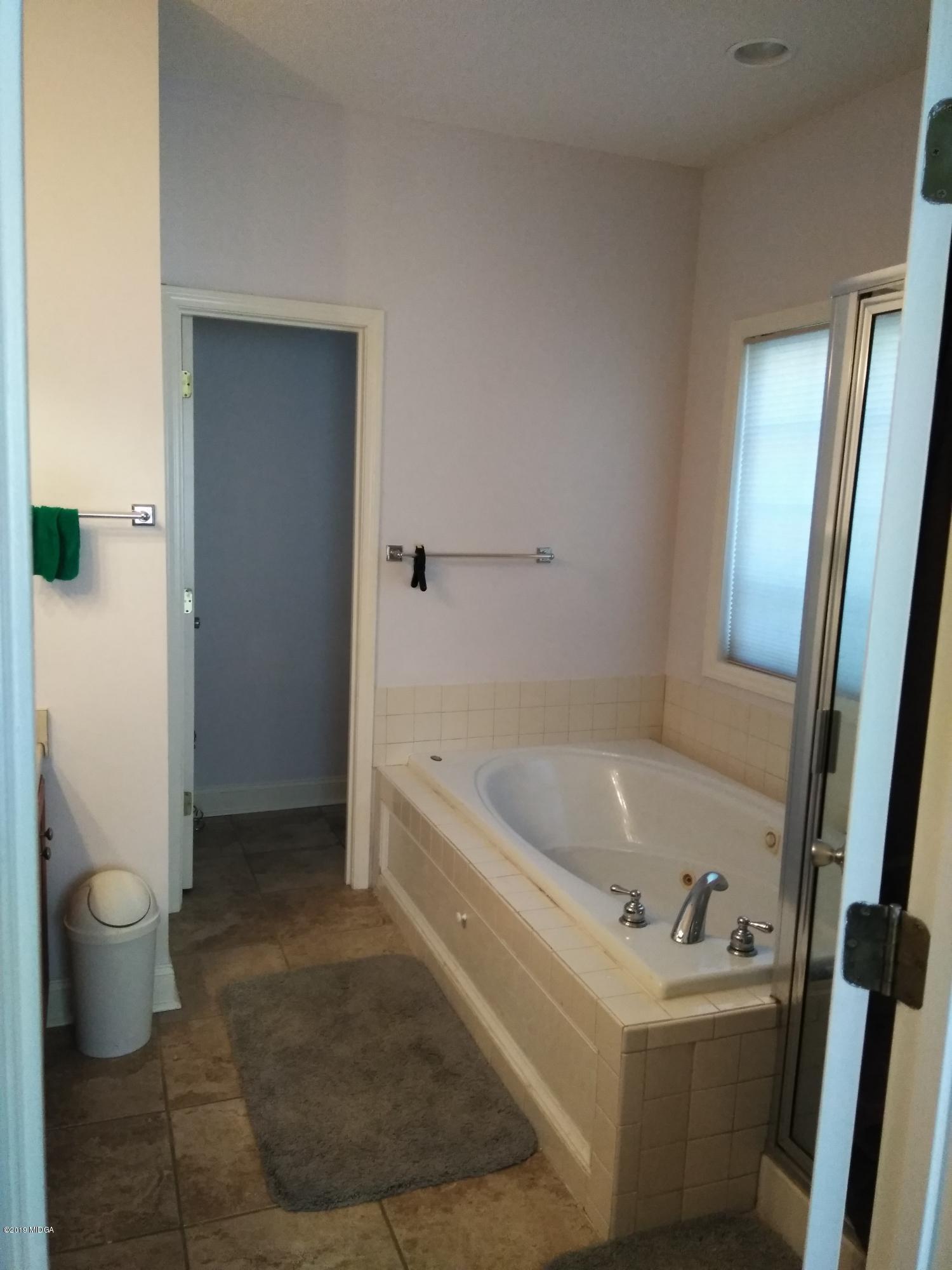 304 Browning Pointe Road Macon, GA 31216 - Photo 9 of 15 a bathroom with a tub sink and toilet