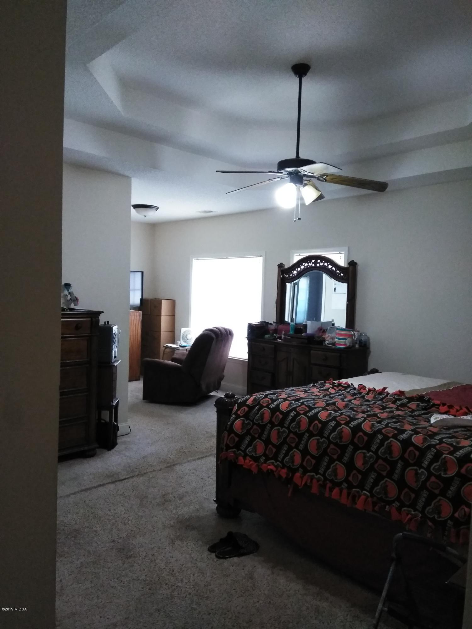 304 Browning Pointe Road Macon, GA 31216 - Photo 10 of 15 a bedroom with a bed ceiling fan and a wooden floor