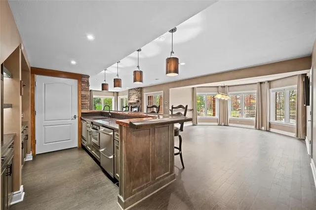 a kitchen with stainless steel appliances granite countertop a stove and a refrigerator