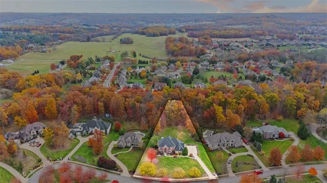 an aerial view of residential house with outdoor space