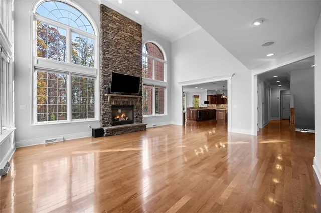 a view of living room with furniture and a fireplace