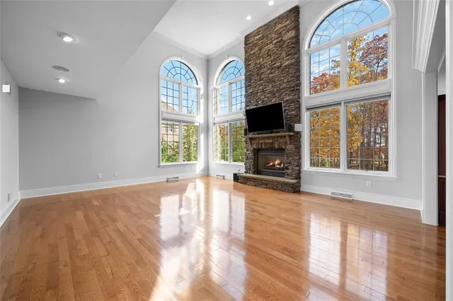 a view of livingroom with furniture flat screen tv and windows