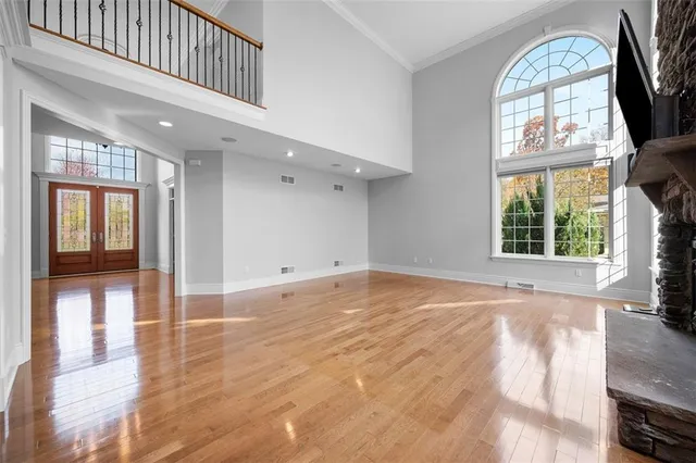a view of an entryway with wooden floor and door