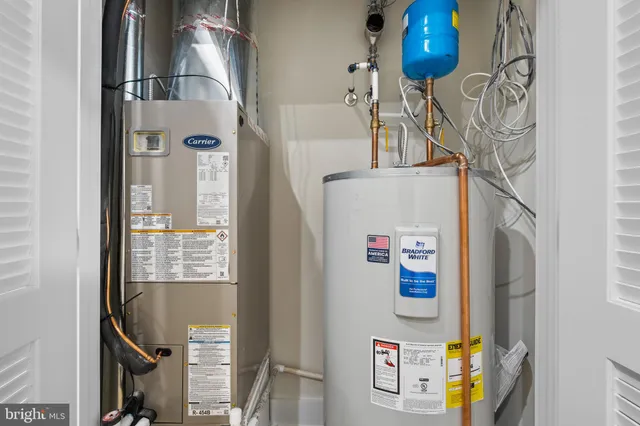 a bedroom with a bed and a potted plant