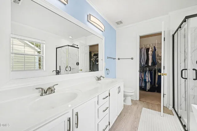 a spacious bedroom with a bed and a window