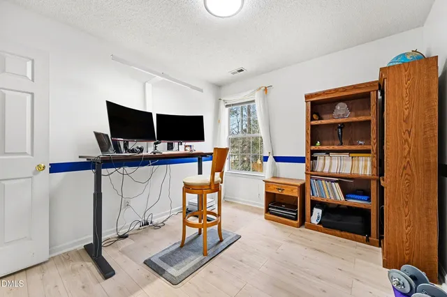 a spacious bathroom with a double vanity sink a mirror a and a shower